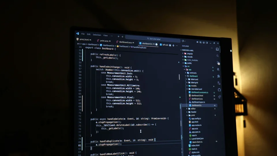 Lines of code on a desktop monitor represent website maintenance work.